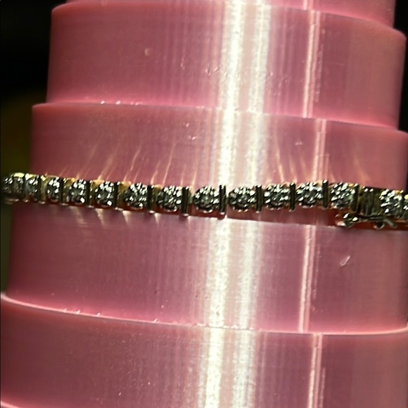 Elegant Silver and gold Bracelet with Sparkling diamond Accents.